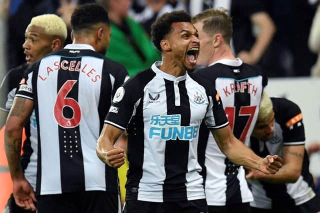 Newcastle United's English midfielder Jacob Murphy celebrates after Newcastle United's Brazilian midfielder Bruno Guimaraes (R) scored the team's second goal during the English Premier League football match between Newcastle United and Arsenal at St James' Park in Newcastle-upon-Tyne, north east England on May 16, 2022. (Photo by OLI SCARFF/AFP via Getty Images)