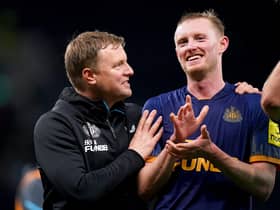 Newcastle United head coach Eddie Howe celebrates with midfielder Sean Longstaff.