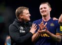 Newcastle United head coach Eddie Howe celebrates with midfielder Sean Longstaff.