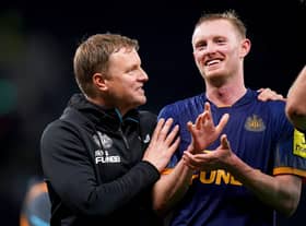 Newcastle United head coach Eddie Howe celebrates with midfielder Sean Longstaff.