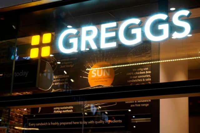 Signage is pictured outside a branch of the bakery chain Greggs inside London Bridge station on November 14, 2020. - Greggs has announced plans to cut over 800 jobs as a result of the coronavirus covid-19 pandemic. (Photo by Niklas HALLE'N / AFP) (Photo by NIKLAS HALLE'N/AFP via Getty Images)