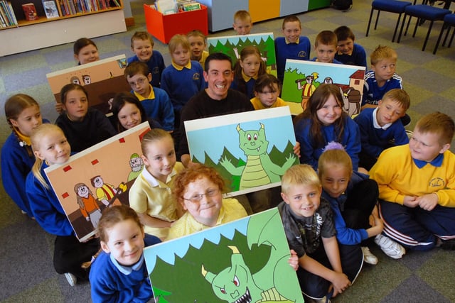 Story teller Adam Bushnell was pictured with pupils from Dunn Street Primary School at the library in 2006.