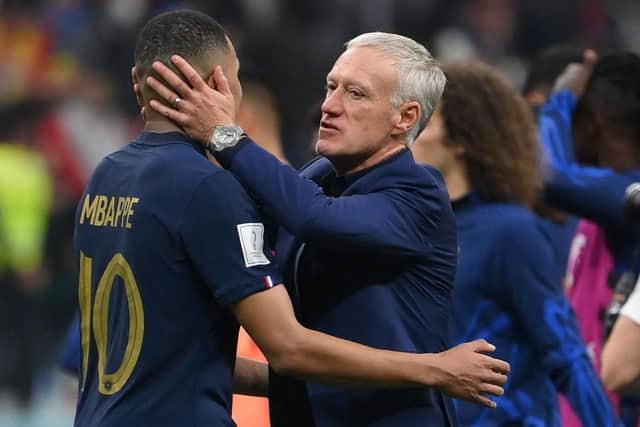 France coach Didier Deschamps embraces Kylian Mbappe as the team reached the World Cup final.