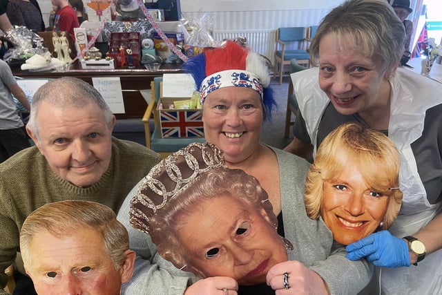 From left to right, Cliff Mann, Susan Stokell and Brenda Thompson with their royal masks.