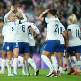 England's Lucy Bronze, right, celebrates scoring against Scotland at Sunderland's Stadium of Light. Photo by Owen Humphreys/PA Wire