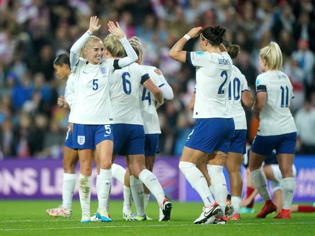 England's Lucy Bronze, right, celebrates scoring against Scotland at Sunderland's Stadium of Light. Photo by Owen Humphreys/PA Wire