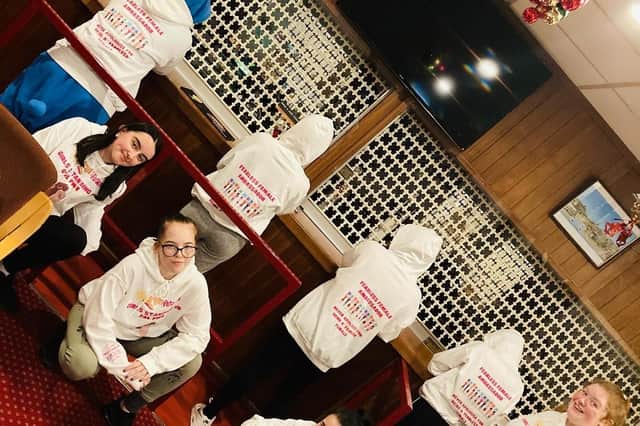 Some of the young people who wrote the letter in their Girls Standing Up hoodie.