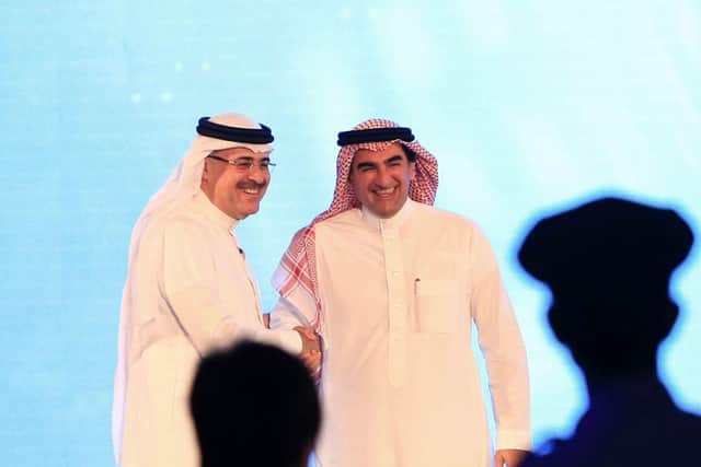 President and CEO of Saudi Aramco Amin Nasser (L) shakes hands with Aramco's chairman Yasir al-Rumayyan after a press conference in the eastern Saudi Arabian region of Dhahran on November 3, 2019. - Saudi Aramco confirmed it planned to list on the Riyadh stock exchange, describing it as a "significant milestone" in the history of the energy giant. (Photo by - / AFP) (Photo by -/AFP via Getty Images)