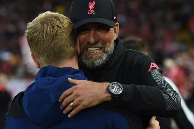 Liverpool manager Jurgen Klopp embraces Newcastle United head coach Eddie Howe before the game at Anfield.