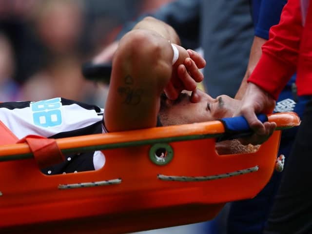 Joelinton of Newcastle United is stretchered off after suffering an injury during the Premier League match between Burnley and Newcastle United at Turf Moor on May 22, 2022 in Burnley, England. (Photo by Jan Kruger/Getty Images)