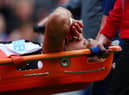 Joelinton of Newcastle United is stretchered off after suffering an injury during the Premier League match between Burnley and Newcastle United at Turf Moor on May 22, 2022 in Burnley, England. (Photo by Jan Kruger/Getty Images)