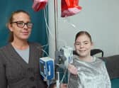 Katy Jones and daughter Hannah Jones with the total parental nutrition machine used to feed Hannah.