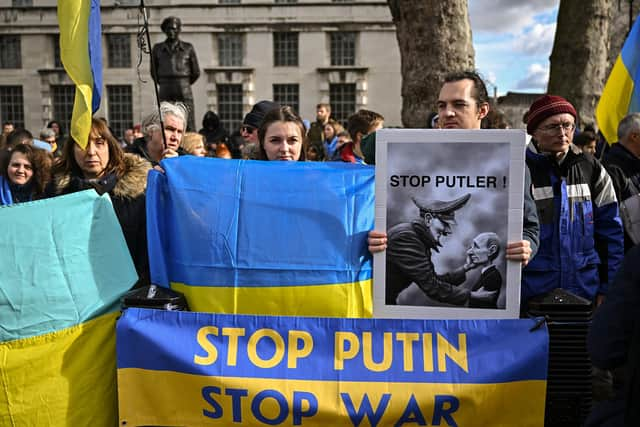 LONDON, ENGLAND - FEBRUARY 24: Ukrainians demonstrate outside Downing Street against the recent invasion of Ukraine on February 24, 2022 in London, England. Overnight, Russia began a large-scale attack on Ukraine, with explosions reported in multiple cities and far outside the restive eastern regions held by Russian-backed rebels. European governments reacted with widespread condemnation and vows of more sanctions. (Photo by Jeff J Mitchell/Getty Images)