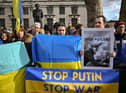 LONDON, ENGLAND - FEBRUARY 24: Ukrainians demonstrate outside Downing Street against the recent invasion of Ukraine on February 24, 2022 in London, England. Overnight, Russia began a large-scale attack on Ukraine, with explosions reported in multiple cities and far outside the restive eastern regions held by Russian-backed rebels. European governments reacted with widespread condemnation and vows of more sanctions. (Photo by Jeff J Mitchell/Getty Images)