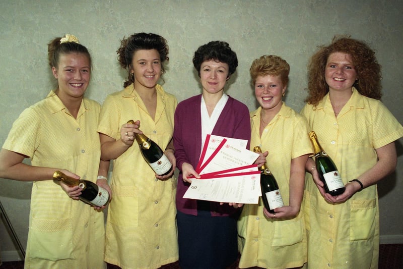 Dewhirsts staff completed the National Vocational Qualification in Production Machine Sewing in 1991. Pictured with Training Assessor Lynda Bell, are from left: Joanne Newton, Sharon Kennedy, Christine Worthy and Christine Wilson.