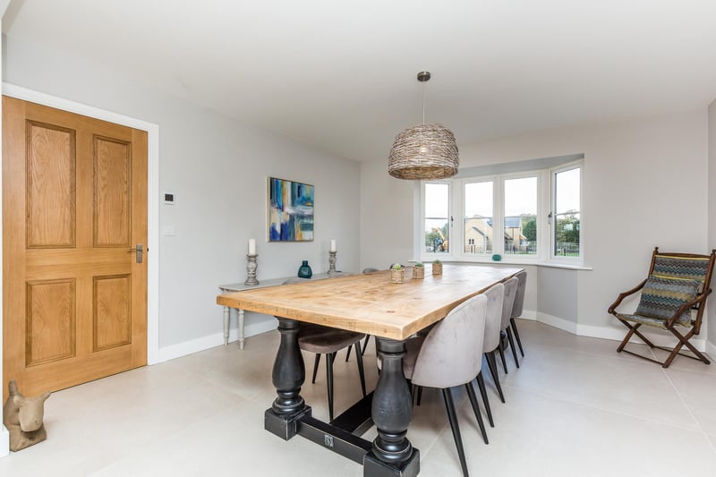 This dining area adjoins the kitchen is set into a bay window