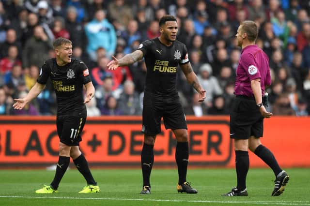 SWANSEA, WALES - SEPTEMBER 10: Matt Ritchie of Newcastle United (L) and Jamaal Lascelles of Newcastle United (R) appeal for a penalty during the Premier League match between Swansea City and Newcastle United at Liberty Stadium on September 10, 2017 in Swansea, Wales.  (Photo by Stu Forster/Getty Images)