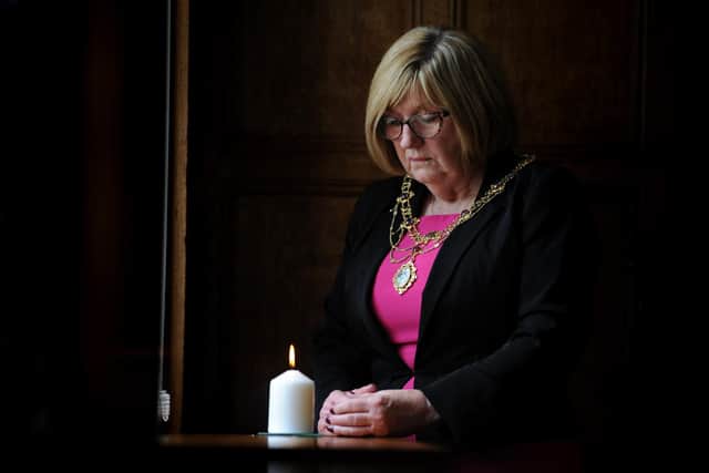 The Mayoress of South Tyneside Mrs Jean Copp lights a candle at South Shields Town Hall to Remember Srebrenica.