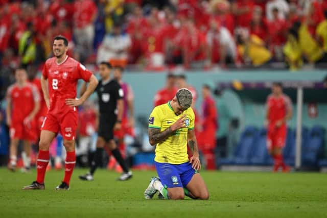 Bruno Guimaraes celebrates Brazil's win over Switzerland.