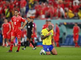 Bruno Guimaraes celebrates Brazil's win over Switzerland.