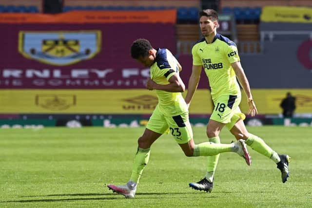 Newcastle United's English midfielder Jacob Murphy (L) celebrates after scoring the 1-1 equalising goal during the English Premier League football match between Burnley and Newcastle United at Turf Moor in Burnley, north west England on April 11, 2021.