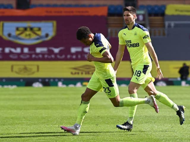 Newcastle United's English midfielder Jacob Murphy (L) celebrates after scoring the 1-1 equalising goal  during the English Premier League football match between Burnley and Newcastle United at Turf Moor in Burnley, north west England on April 11, 2021.