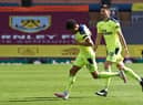 Newcastle United's English midfielder Jacob Murphy (L) celebrates after scoring the 1-1 equalising goal  during the English Premier League football match between Burnley and Newcastle United at Turf Moor in Burnley, north west England on April 11, 2021.