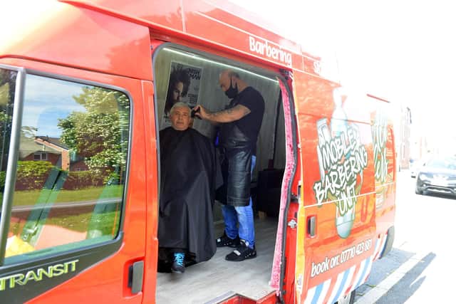 Ali Barber owner Ali Sezer with his new mobile barber van.