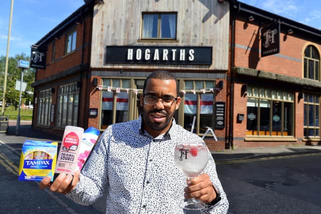 Manager Alex Ozobia at Hogarths, which is running a donation drop for a food bank, with kind-hearted customers taking part to receive a free gin and tonic for World Gin Day.