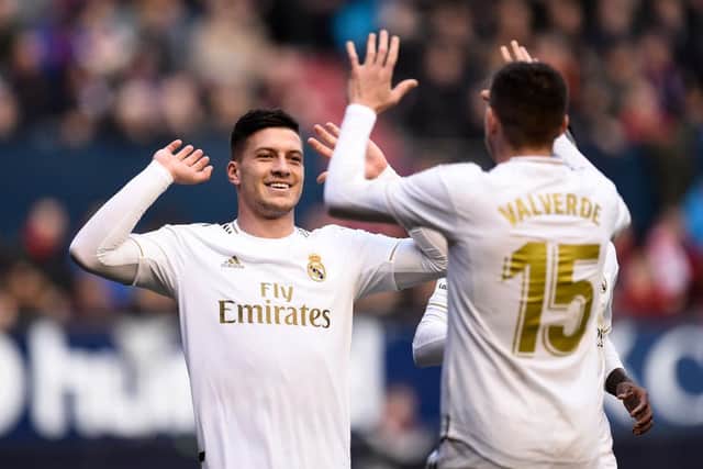 PAMPLONA, SPAIN - FEBRUARY 09: Luka Jovic of Real Madrid celebrates with Federico Valverde after scoring his team's fourth goal during the La Liga match between CA Osasuna and Real Madrid CF at El Sadar Stadium on February 09, 2020 in Pamplona, Spain. (Photo by Juan Manuel Serrano Arce/Getty Images)