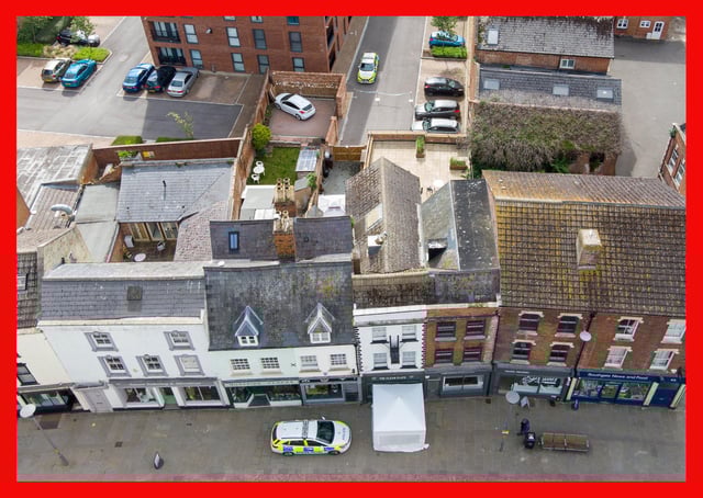 Police activity at The Clean Plate cafe in Southgate Street, Gloucester where excavation work is to begin after police found "possible evidence" of where Mary Bastholm, a suspected teenage victim of serial killer Fred West may be buried. Picture date: Tuesday May 18, 2021.