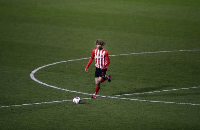 Dion Sanderson of Sunderland in action during the Sky Bet League One match between Shrewsbury Town and Sunderland at Montgomery Waters Meadow on February 09, 2021 in Shrewsbury.