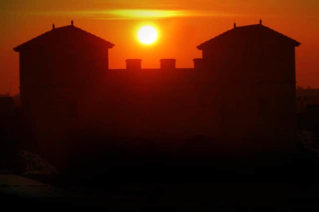 A stunning 2004 scene showing a sunset over Arbeia Roman fort.