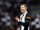 Matt Targett of Newcastle United applauds the fans after the Premier League match between Newcastle United and Wolverhampton Wanderers at St. James Park on April 08, 2022 in Newcastle upon Tyne, England. (Photo by Naomi Baker/Getty Images)