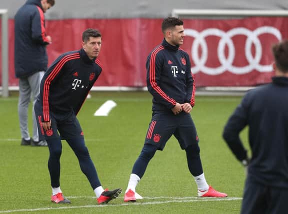 MUNICH, GERMANY - FEBRUARY 24: Robert Lewandowski (L) and Lucas Hernandez of FC Bayern Muenchen warm up during a training session ahead of their Champions League round of 16 match against Chelsea FC at Saebener Strasse training ground on February 24, 2020 in Munich, Bavaria. (Photo by Alexandra Beier/Getty Images)