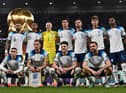 England players pose for a squad photo ahead of their Group B clash with Wales - with a 3-0 victory in the game setting up a last-16 tie with Senegal. (Photo by PAUL ELLIS/AFP via Getty Images)