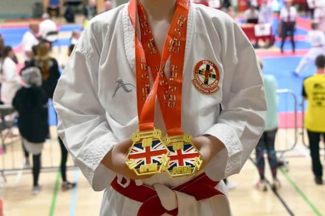 Ewan Baxter with his two golds.