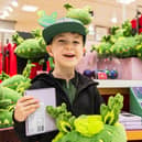 A delighted Tommy Lamb with his Snapper-themed goodies. Photo by Caters Photographic/PA Wire