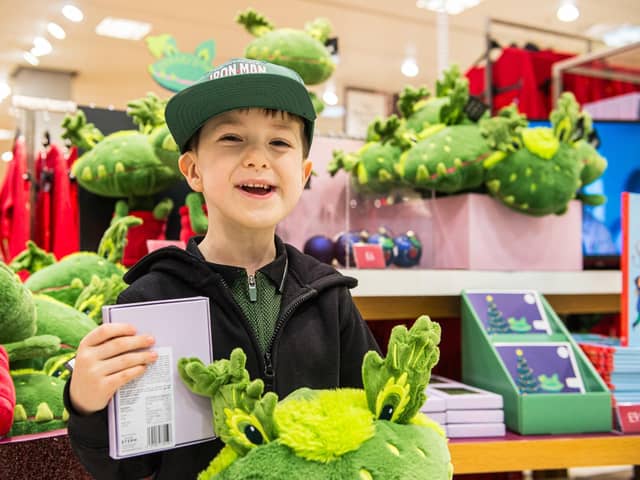 A delighted Tommy Lamb with his Snapper-themed goodies. Photo by Caters Photographic/PA Wire