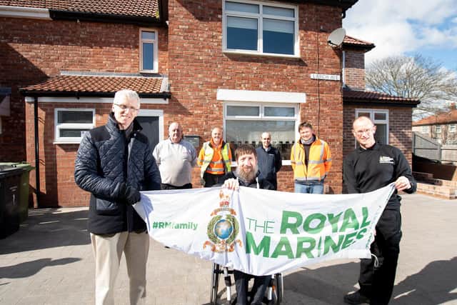 (L to R) Front row - Neil Turner, Director- Howarth Litchfield, Jason Burns, war veteran and Jonathan Ball, Chief Executive- RMA- The Royal Marines Charity 
Back row:  Members of T Manners & Sons Construction Team