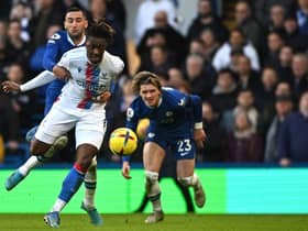 Crystal Palace's English midfielder Eberechi Eze (C) is held back by Chelsea's Moroccan midfielder Hakim Ziyech (L) as Conor Gallagher watches on during the English Premier League football match between Chelsea and Crystal Palace at Stamford Bridge in London on January 15, 2023.  (Photo by BEN STANSALL/AFP via Getty Images)