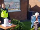 Mary celebrating her 90th birthday with PC Neil Morris and PCSO Gayle Muizelaar. 
Image by Northumbria Police.