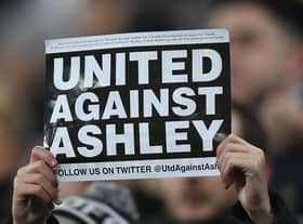 NEWCASTLE UPON TYNE, ENGLAND - JANUARY 29: A fan holds up a 'United Against Ashley' card during the Premier League match between Newcastle United and Manchester City at St. James Park on January 29, 2019 in Newcastle upon Tyne, United Kingdom. (Photo by Stu Forster/Getty Images)