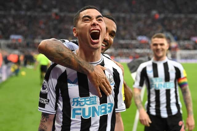 NEWCASTLE UPON TYNE, ENGLAND - OCTOBER 29: Goalscorer Miguel Almiron celebrates after scoring the fourth Newcastle goal with Callum Wilson (r) during the Premier League match between Newcastle United and Aston Villa at St. James Park on October 29, 2022 in Newcastle upon Tyne, England. (Photo by Stu Forster/Getty Images)