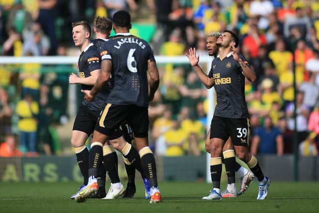 Bruno Guimaraes of Newcastle United  celebrates after scoring their side's third goal during the Premier League match between Norwich City and Newcastle United at Carrow Road on April 23, 2022 in Norwich, England. (Photo by Stephen Pond/Getty Images)