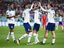 Jack Grealish celebrates with Callum Wilson and Marcus Rashford  after scoring their team's sixth goal during the FIFA World Cup Qatar 2022 Group B match between England and IR Iran at Khalifa International Stadium on November 21, 2022 in Doha, Qatar. (Photo by Matthias Hangst/Getty Images)