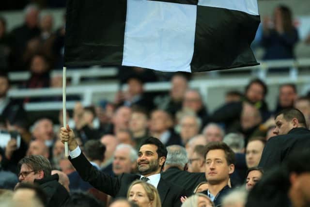 Mehrdad Ghodoussi, husband of Newcastle United's English minority owner Amanda Staveley waves a flag in the crowd ahead of the English Premier League football match between Newcastle United and Wolverhampton Wanderers at St James' Park in Newcastle-upon-Tyne, north east England on April 8, 2022.(Photo by LINDSEY PARNABY/AFP via Getty Images)