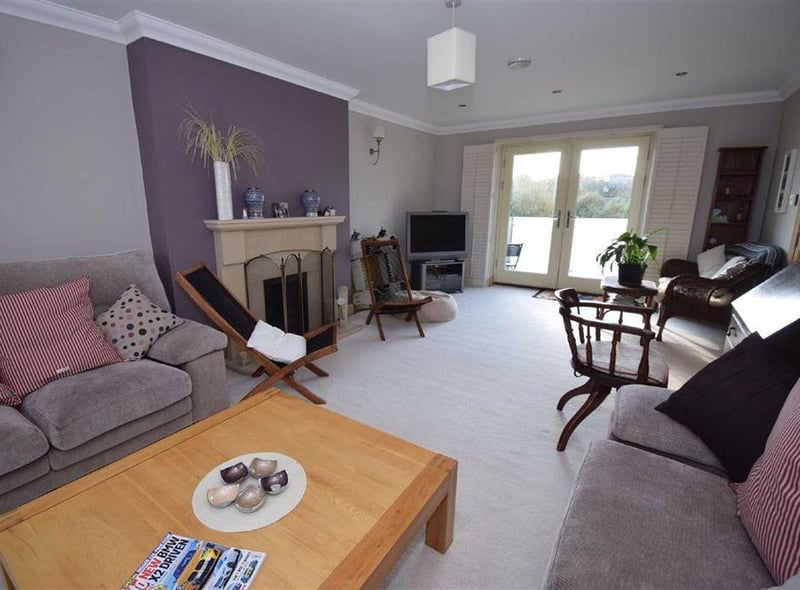 The living room has Minster style stone fire surround and multi fuel stove.