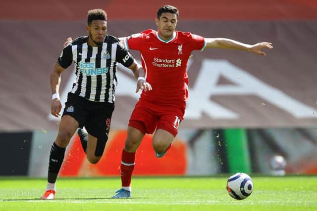 Newcastle United's Brazilian striker Joelinton (L) vies with Liverpool's Turkish defender Ozan Kabak during the English Premier League football match between Liverpool and Newcastle United at Anfield in Liverpool, north west England on April 24, 2021.