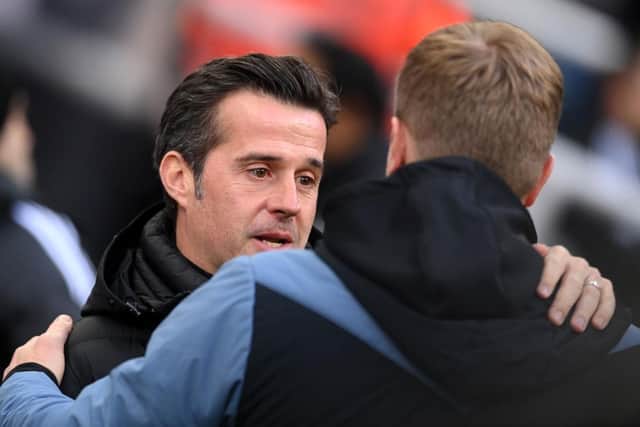 Fulham head coach Marco Silva embraces Eddie Howe, his Newcastle United countre-art, before yesterday's game.